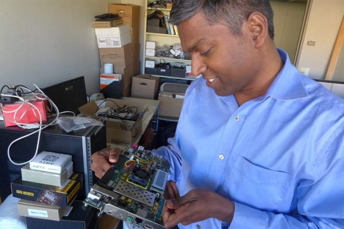 Founder of SimpleMachines, examines a prototype