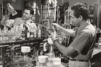 Two men in a lab in the 1950s