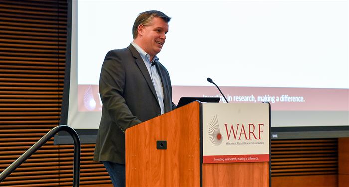 Mike Partsch standing at a podium