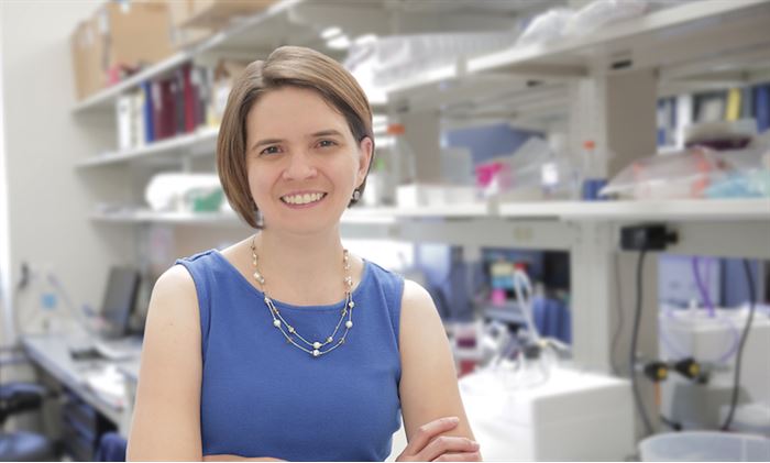 Pamela Kreeger standing in a lab