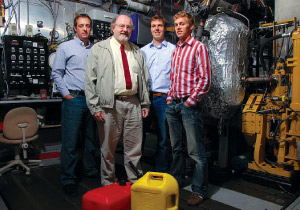 Reed Hanson, Rolf Reitz, Derek Splitter and Sage Kokjohn standing together in a workshop